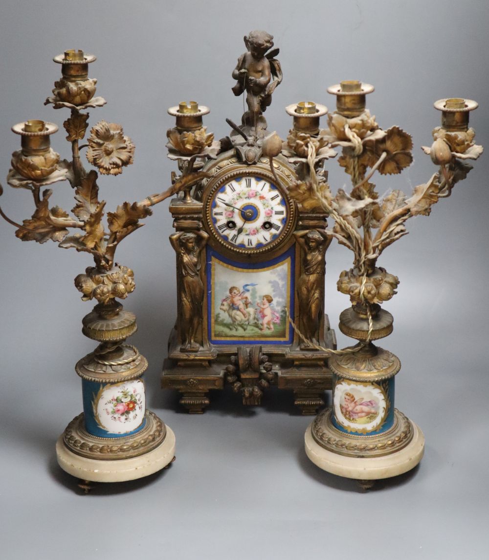 A 19th century French ormolu and Sèvres style porcelain matched garniture de cheminée